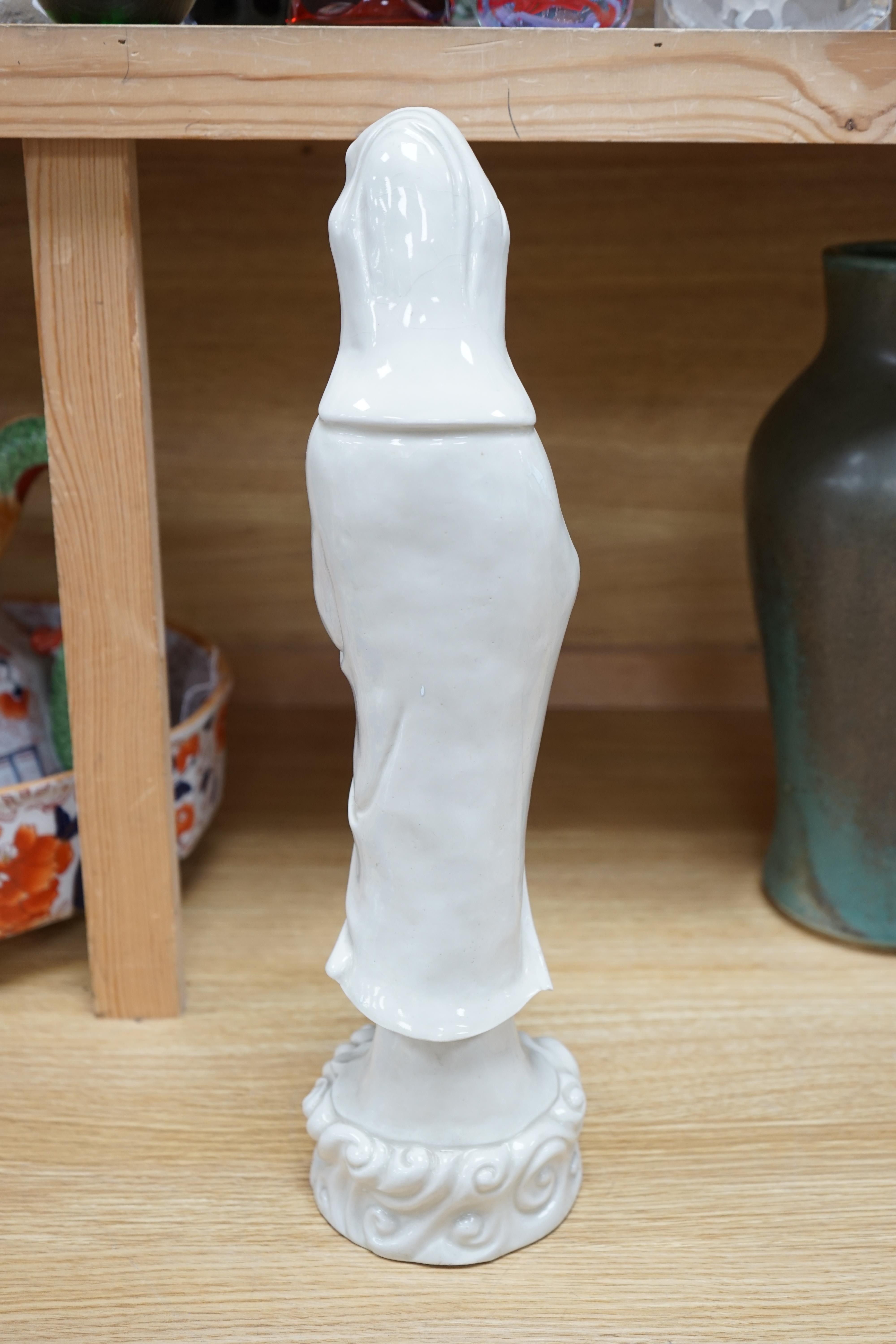 A Chinese blanc de chine figure of Guanyin, early 20th century, 45cm high. Condition - poor to fair, a number of fingers broken and missing